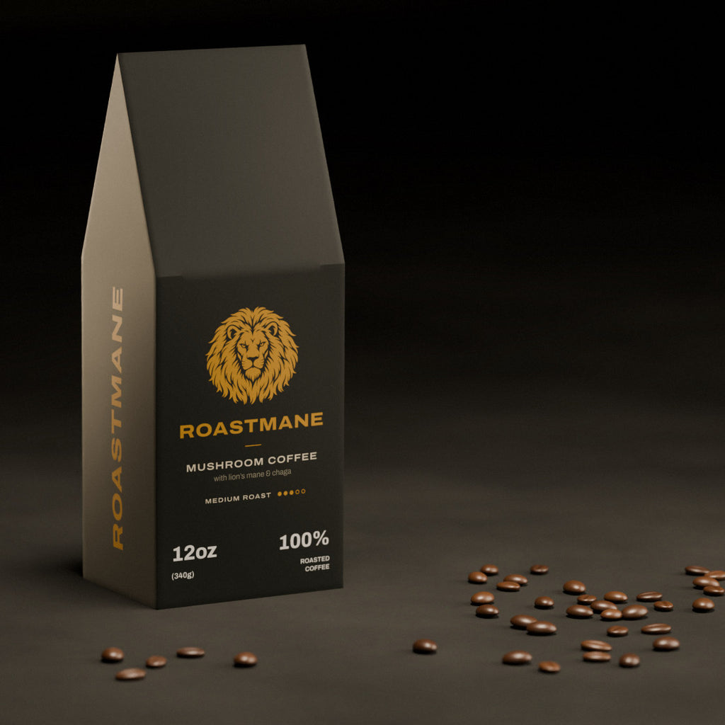Roastmane Mushroom Coffee box on a dark slate table with scattered coffee beans