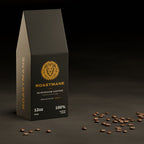 Roastmane Mushroom Coffee box on a dark slate table with scattered coffee beans